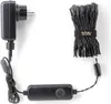 A black power adapter, a black controller box with a button, and a bundle of black LED string lights are laid out on a white background. Náhled obrázku produktu