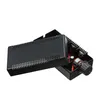 A black electronic device with a knob, shown from a diagonal angle against a white background. Produktbild-Vorschau