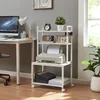 A home office setup with a desk, computer, lamp, and a rolling printer stand. Anteprima dell’immagine prodotto