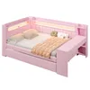 A pink daybed with integrated lighting and storage, styled with bedding and cushions. Produktbild-Vorschau