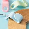 A close-up of plastic clothes hanger connectors in pastel colors. Produktbild-Vorschau