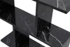 A close-up view of a black marble side table with white veining. Náhled obrázku produktu