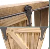 Close-up of a wooden cabinet with sliding door hardware and decorative metal brackets. Náhled obrázku produktu