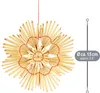A straw star ornament hanging against a white background, with a size indicator on the right. Produktbild-Vorschau