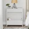 A white side table with a lamp and books on it, next to a bed. Anteprima dell’immagine prodotto