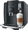 A black Jura E8 coffee machine with a glass of latte macchiato in front of it. Anteprima dell’immagine prodotto