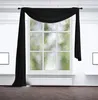 A black fabric scarf draped over a window.