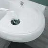 A close-up view of a white ceramic sink with chrome drain fittings. Produktbild-Vorschau