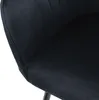 A close-up view of a black velvet chair. Náhled obrázku produktu