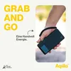 A hand holding a black power bank with a wrist strap. Produktbild-Vorschau
