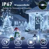 A snowy winter scene with a decorated house and yard, featuring Christmas lights and a snowman. Produktbild-Vorschau