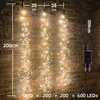 A string of fairy lights hanging on a brick wall, with dimensions indicated by text overlays. Produktbild-Vorschau