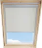 A beige roller blind installed in a wooden framed skylight, with a blue sky visible through the lower part of the window. Produktbild-Vorschau
