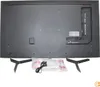 The back of a television set with its accessories laid out on a white background. Podgląd zdjęcia produktu
