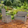 A garden chair and bench set on a wooden deck in a lush garden. Produktbild-Vorschau