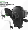 Close-up marketing image of a car phone mount with a magnetic cord organizer feature. Produktbild-Vorschau