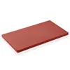 A red cutting board shown from a slight angle on a white background. Anteprima dell’immagine prodotto