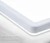 Close-up of the corner of a white LED ceiling lamp, showing its edge and a subtle backlight effect. Produktbild-Vorschau