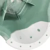 A close-up view of a green and white plastic step stool. Produktbild-Vorschau
