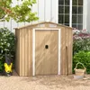 A metal garden shed with double doors, surrounded by greenery and gravel. Anteprima dell’immagine prodotto
