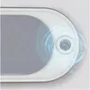 A close-up view of a button on a white ultrasonic cleaner, with blue ripple effects emanating from it. Voir les images du produit
