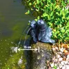 A garden pond with a decorative fountain featuring two seals. Produktbild-Vorschau