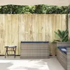 An outdoor storage bench with cushions is placed on a patio next to a wooden fence. Náhľad obrázku produktu