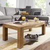 A living room scene with a sectional sofa and a wooden coffee table. Produktbild-Vorschau
