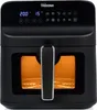 A black Tristar air fryer with a display showing 200 degrees Celsius and 15 minutes, and various cooking icons. The interior of the air fryer is illuminated and shows a cooking rack. Produktbild-Vorschau