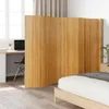 A room divider is placed between a bedroom area and a desk area near a window. Podgląd zdjęcia produktu