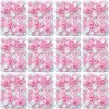 A grid of artificial flower wall panels, predominantly pink and white. Voir les images du produit