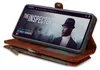 A brown leather wallet phone case is open, displaying a smartphone with a movie poster on its screen. Produktbild-Vorschau