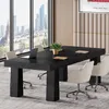 A modern office meeting room with a large black table, chairs, and a city view through the window. Podgląd zdjęcia produktu