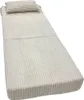 A folded mattress with a pillow on a white background. Produktbild-Vorschau