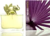 A perfume bottle with a gold elephant topper and its packaging. Podgląd zdjęcia produktu