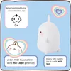 A white plush toy is shown on a light blue background with decorative hearts and text. Náhled obrázku produktu