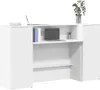 A white reception desk with a laptop, books, and a plant. Náhľad obrázku produktu