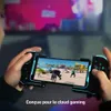 A person is holding a mobile gaming controller with a game displayed on the screen, with a blurred background of a TV. Produktbild-Vorschau