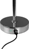 Close-up of the base of a chrome table lamp, showing a USB charging port with a green indicator light and a black USB cable plugged in. Produktbild-Vorschau