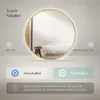A circular LED mirror with a gold frame is displayed in a bathroom setting, showcasing its features. Produktbild-Vorschau