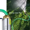 A submersible pump connected to a green hose spraying water onto a lawn. Anteprima dell’immagine prodotto