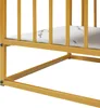 A close-up view of the lower section of a gold-colored metal frame table with a white marble-patterned shelf. Náhľad obrázku produktu