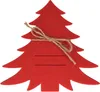 A red felt Christmas tree-shaped cutlery holder with two slots for cutlery and a twine tie. Produktbild-Vorschau