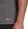 A close-up of a person's arm and a gray t-shirt with the Adidas Aeroready logo. Podgląd zdjęcia produktu