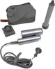 A collection of hair styling accessories, including a hair dryer, attachments, a charging cable, and a storage pouch, laid out on a white background. Podgląd zdjęcia produktu