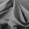 A close-up view of draped gray fabric, likely a curtain or textile. Produktbild-Vorschau