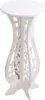 A white decorative plant stand with intricate cutouts. Produktbild-Vorschau