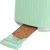 A close-up view of a green toaster with its crumb tray extended, filled with crumbs. Podgląd zdjęcia produktu