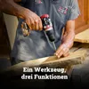 A person is using a cordless drill to screw a screw into a wooden plank. Produktbild-Vorschau