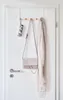 A door hanger with hooks holding a folded umbrella, a handbag, and a scarf. Náhľad obrázku produktu